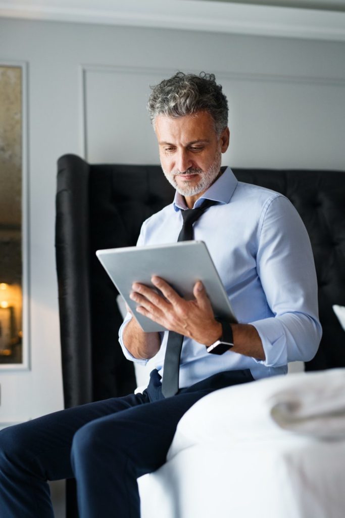 mature businessman with tablet